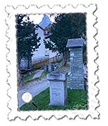 The Mountaineers' Cemetery in Zermatt shows the Matterhorn and the grave of one who died on the 1865 expedition